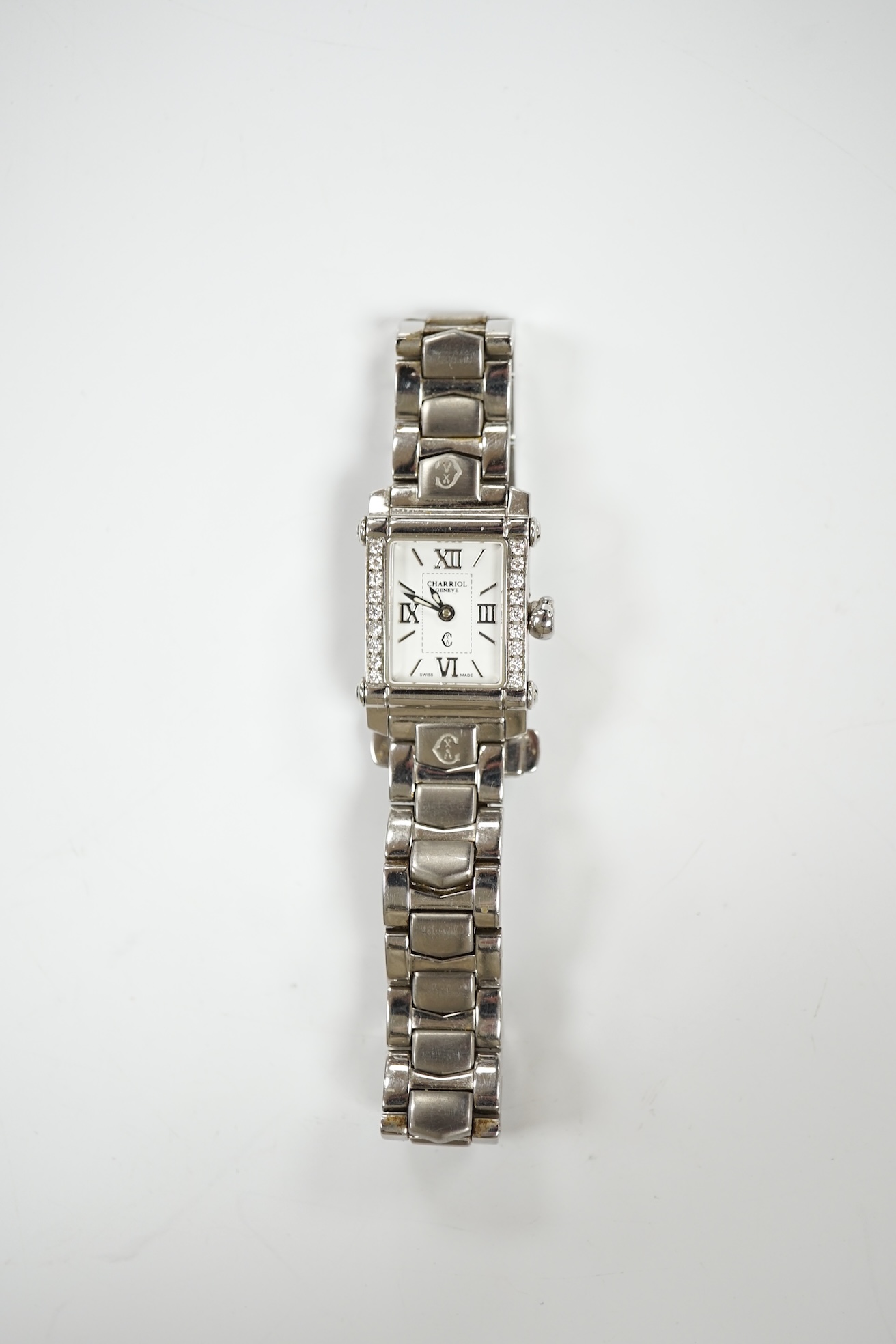 A lady's stainless steel Charriol Columbus quartz wrist watch with rectangular dial and diamond chip set bezel, on a stainless steel bracelet. Condition - fair